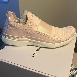 Brand new never worn women’s APL sneakers in a beautiful cream/blush color.